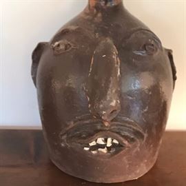 Large face jug. Nose has been repaired.