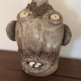 Great face jug,some damage to top of jug.