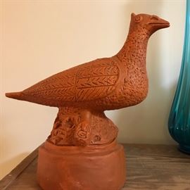 Large fired pottery bird.