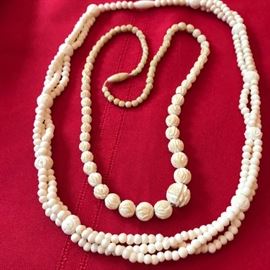 two more asian carved necklaces.