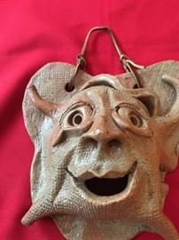 A whimsical take on the classic green man face...it's a wall pocket.