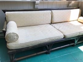 Vintage bamboo sofa. It has a matching side table.