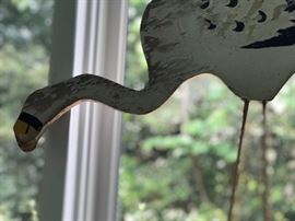 Carved and painted antique bird.