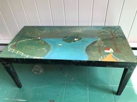 A painted coffee table by a local artist, Michael Giaquinto.