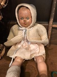 Antique doll with scary eyes.