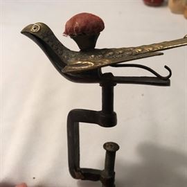 Victorian "3rd Hand" It clamps on the table, has a pin cushion and will even hold fabric in it's mouth if you need it!
