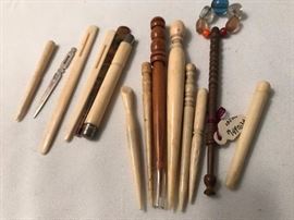 Antique bobbins, hooks, and other tools.