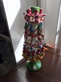 One of a pair of large festive, colorful Mexican candlesticks.