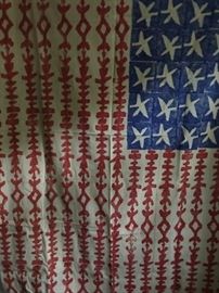 Large printed American flag artwork.