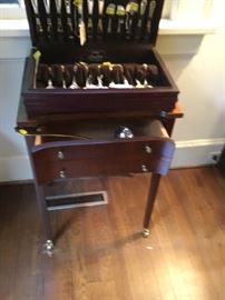 Silver chest with lots of interesting flatware.