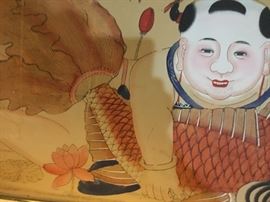Large oriental print at the top of the stairs.