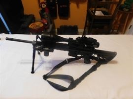 AR-15 5.56 Rugar 223 Cal. Quad Rail, Armed Forces Green laser, Tripod w/adj. legs, 6-24x50 AOEG Bushnell Scope, Waterproof, fog, Shockproof, Red and green illuminated graphic sight. Red /Green dot scope mounted on Bushnell scope, Bungee Sling.  NEVER FIRED All NEW With Box. 
