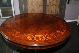 Rare English "Loo" table. Circa 1900. Burled walnut with inlays. Totally awesome example. Approximately 50 inches in diameter. Includes 4 Chippendale Chairs.