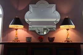 Pair of McKinsey Childs' lamps shown with DeFarge Quatrafoil mirror. 