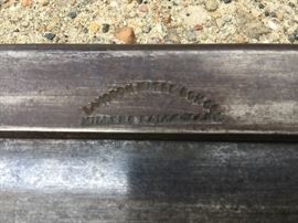 Stamped on top of saw blade