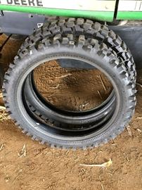 Dirt bike tires. Track Master 100/100-18 knobby and Bridgestone 120/80-18 M/C 62P. Looks like they were never used.