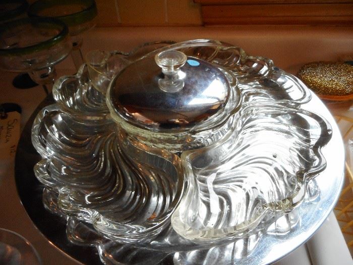 Mid Century, Glass Swirl Insert sits on Chrome Lazy Susan, with Chrome/Glass Serve Ware