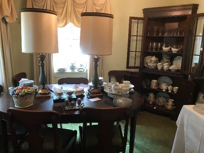 Cherry Dining room table with cushioned bottom chairs along with corner China cabinet