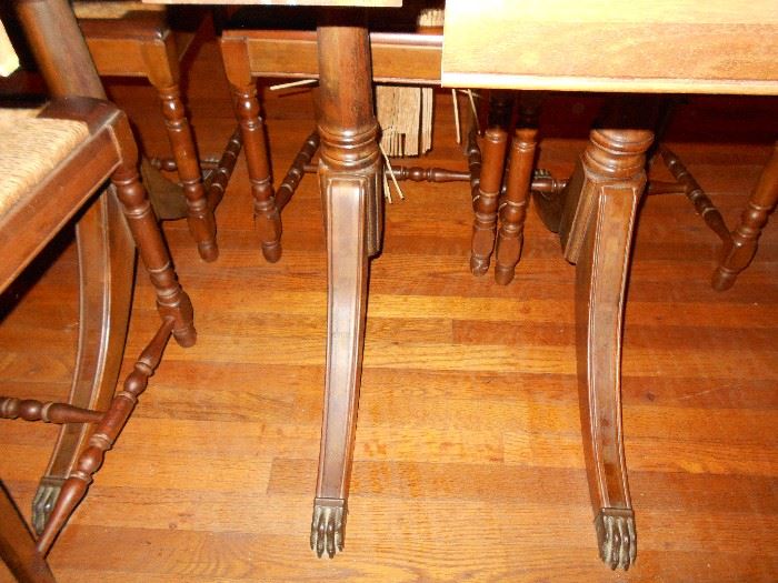 Underside of table showing 6 claw feet