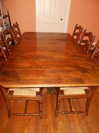Antique table with leaves & 6 woven straw chairs,