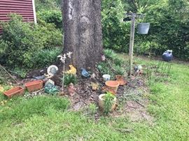 Lots of pots and yard decoratiive items