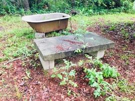 Old vintage bath tub
2 thick concrete slabs