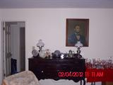 Lincoln print by Griswold Tyng; antique buffet; pewter items and lamps.