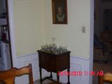 Small table and glassware; print