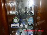 glassware, sterling silver candlesticks and salt and pepper shakers.