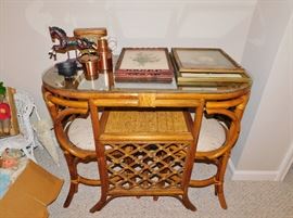 The two chairs to this rattan table slide under the  glass top to save space. So cute!