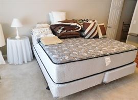 Like-new California King mattress and box springs. Eight  piece King comforter set.
