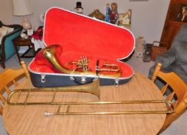 Vintage tuba and trombone in rough condition