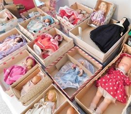Many Nancy Ann Storybook dolls all in their boxes. 
