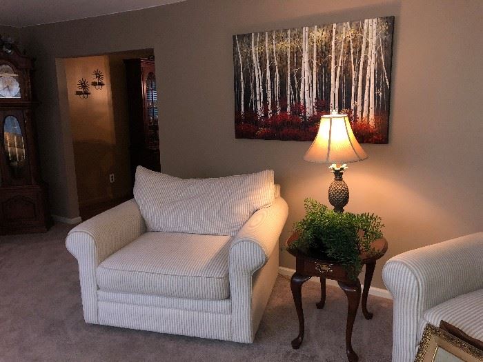  Family Heritage Estate Sales, LLC. New Jersey Estate Sales/ Pennsylvania Estate Sales. White Armchairs. Endtable. Decorative Lamp. Art. 