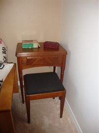 Singer sewing machine in table with stool and accessories