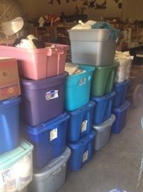 tubs of sewing supplies and material