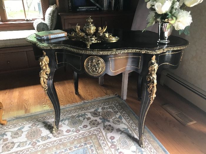 19th Century Gilt Bronze Mounted Brass inlay ebonized center table, gilt tooled black leather writing surface, cabriole legs, headed by caryatids. 