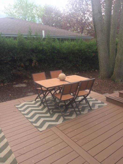 Patio table, chairs and rug