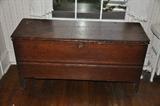 Early 1800's 6-Board pine blanket box w/snipe hinges, boot jack legs & rose head nails construction in original finish.