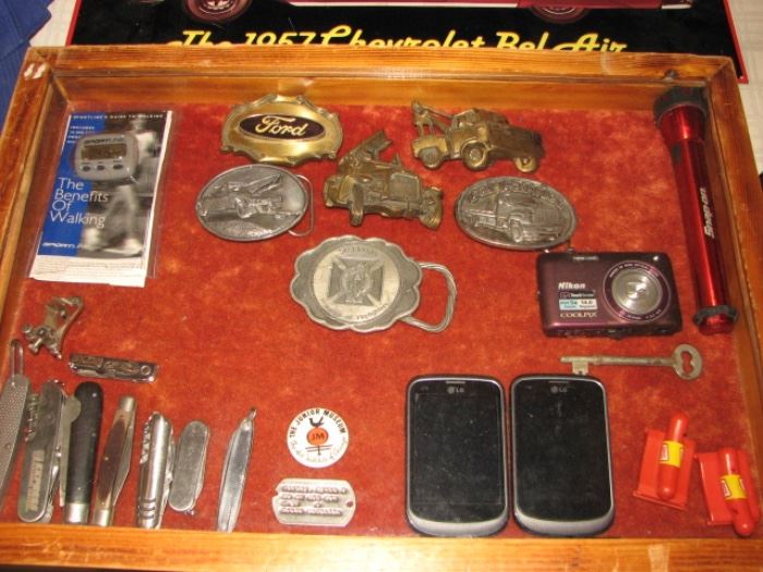 collection of knives, belt buckles