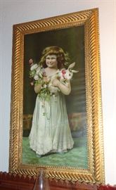 Delightful print of little girl with flowers and rabbit.  Beautifully framed.
