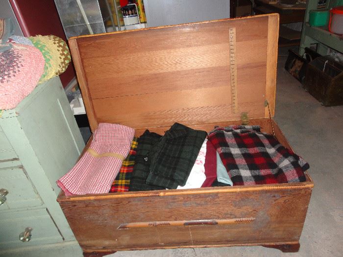 Blanket chest full of wool and other fabrics.
