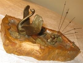 Bronze ducks on stone 