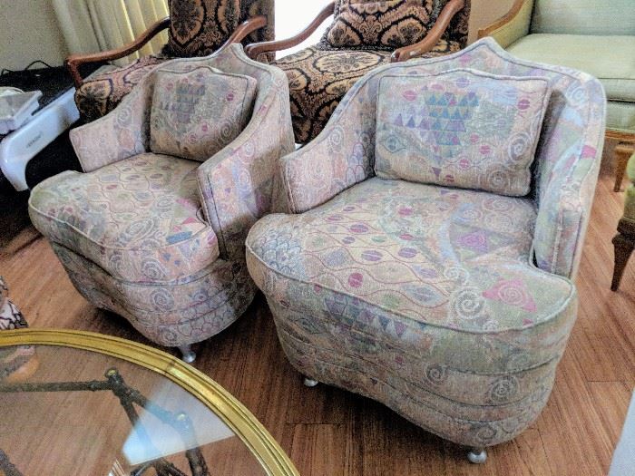 Pair of reupholstered Mid Century Moroccan style lounge chairs in muted geometric print fabric - $300/each

