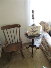 Child's rocker, side table, artwork, lamp