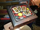 Game box with poker chips and playing cards inside