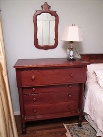 Antique Chest of Drawers with Mirror and Lamp.