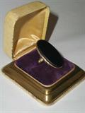 Antique 10K gold ladies ring with 1 1/8" by 1/2" onyx stone. Size 6, weighs 7.2 grams