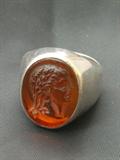 Vintage sterling man's ring with carved classical man in amber colored stone, size 8, marked .925, weighs 11.7 grams