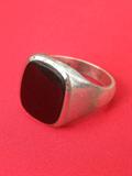 Large sterling man's ring with onyx stone, marked sterling, size 10 1/2, weighs 11.6 grams